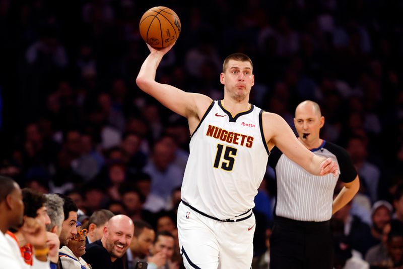 NEW YORK, NEW YORK - JANUARY 25: Nikola Jokic #15 of the Denver Nuggets passes the ball during the first half against the New York Knicks at Madison Square Garden on January 25, 2024 in New York City. NOTE TO USER: User expressly acknowledges and agrees that, by downloading and/or using this Photograph, user is consenting to the terms and conditions of the Getty Images License Agreement. (Photo by Sarah Stier/Getty Images)