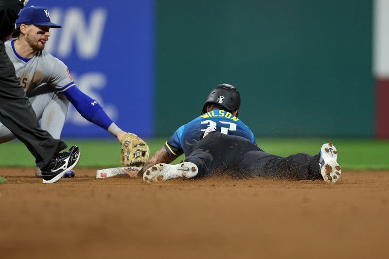 Sep 12, 2025; Philadelphia, Pennsylvania, USA; Philadelphia Phillies outfielder Weston Wilson (37) steals second base in front of Kansas City Royals shortstop Bobby Witt Jr. (7) during the seventh inning at Citizens Bank Park. Mandatory Credit: Bill Streicher-Imagn Images