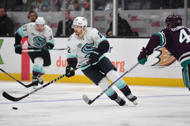 Dec 23, 2023; Anaheim, California, USA; Seattle Kraken right wing Oliver Bjorkstrand (22) moves the puck against the Anaheim Ducks during the third period at Honda Center. Mandatory Credit: Gary A. Vasquez-USA TODAY Sports