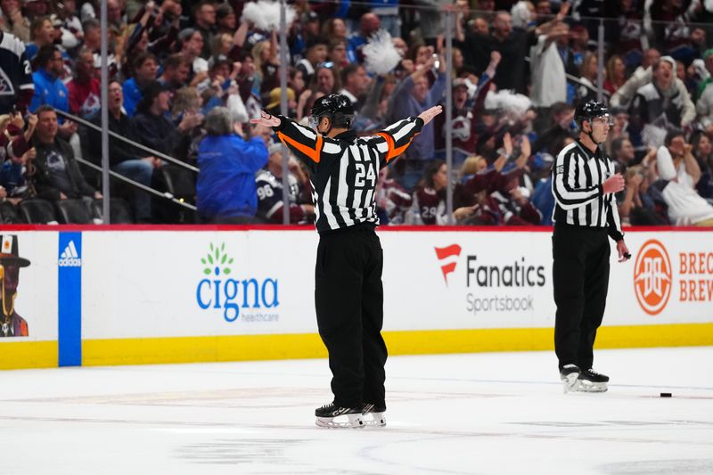 May 17, 2024; Denver, Colorado, USA; NHL referee Eric Furlatt (27) calls off a goal by Dallas Stars left wing Mason Marchment (27) (not pictured) in an overtime period against the Colorado Avalanche in game six of the second round of the 2024 Stanley Cup Playoffs at Ball Arena. Mandatory Credit: Ron Chenoy-USA TODAY Sports