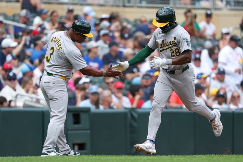 Jun 16, 2024; Minneapolis, Minnesota, USA; Oakland Athletics right fielder Daz Cameron (28) runs the bases after his solo home run against the Minnesota Twins during the seventh inning of game one of a double header at Target Field. Mandatory Credit: Matt Krohn-USA TODAY Sports