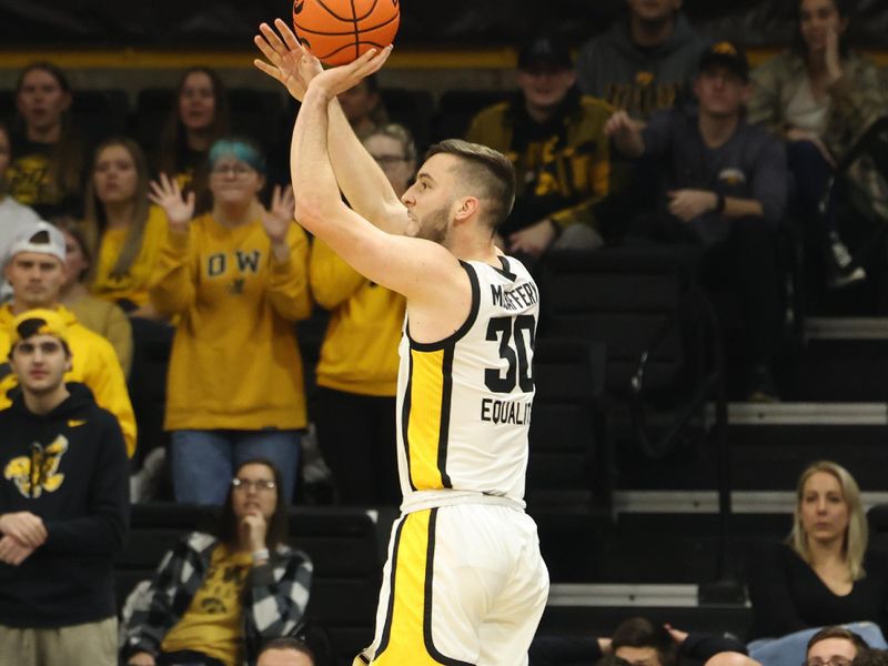 Jan 15, 2023; Iowa City, Iowa, USA; Iowa Hawkeyes guard Connor McCaffery (30) shoots against the Maryland Terrapins at Carver-Hawkeye Arena. Mandatory Credit: Reese Strickland-USA TODAY Sports