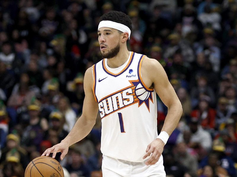 NEW ORLEANS, LOUISIANA - JANUARY 19: Devin Booker #1 of the Phoenix Suns dribbles the ball down court during the third quarter of an NBA game against the New Orleans Pelicans at Smoothie King Center on January 19, 2024 in New Orleans, Louisiana. NOTE TO USER: User expressly acknowledges and agrees that, by downloading and or using this photograph, User is consenting to the terms and conditions of the Getty Images License Agreement. (Photo by Sean Gardner/Getty Images)