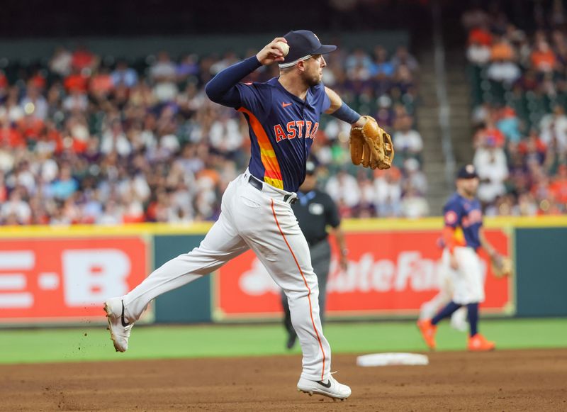 May 15, 2024; Houston, Texas, USA; Houston Astros third baseman Alex Bregman (2) fields Oakland Athletics shortstop Max Schuemann (12) (not pictured) ground ball for an out in the fifth inning at Minute Maid Park. Mandatory Credit: Thomas Shea-USA TODAY Sports