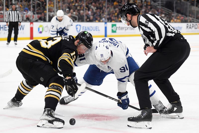 Apr 30, 2024; Boston, Massachusetts, USA; Boston Bruins center Charlie Coyle (13) wins a face-off against Toronto Maple Leafs center John Tavares (91) during the second period in game five of the first round of the 2024 Stanley Cup Playoffs at TD Garden. Mandatory Credit: Bob DeChiara-USA TODAY Sports