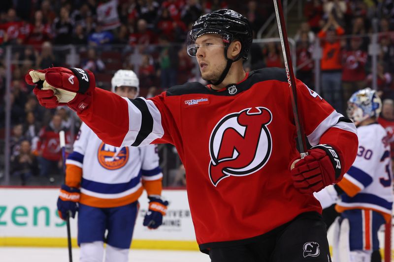 Oct 25, 2024; Newark, New Jersey, USA; New Jersey Devils center Curtis Lazar (42) celebrates his goal against the New York Islanders during the second period at Prudential Center. Mandatory Credit: Ed Mulholland-Imagn Images