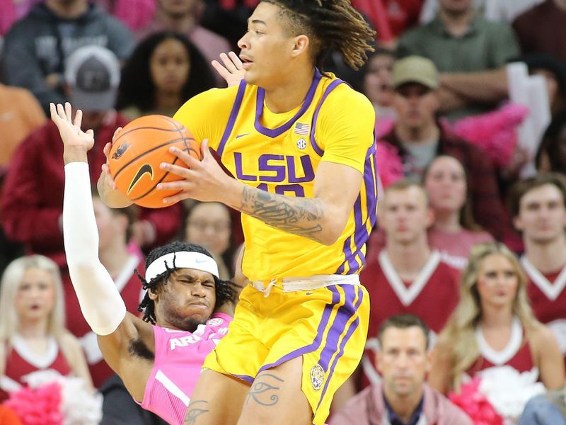 Jan 24, 2023; Fayetteville, Arkansas, USA; Arkansas Razorbacks guard Ricky Council IV (1) takes a charge by LSU Tigers forward Jalen Reed (13) during the first half at Bud Walton Arena. Mandatory Credit: Nelson Chenault-USA TODAY Sports