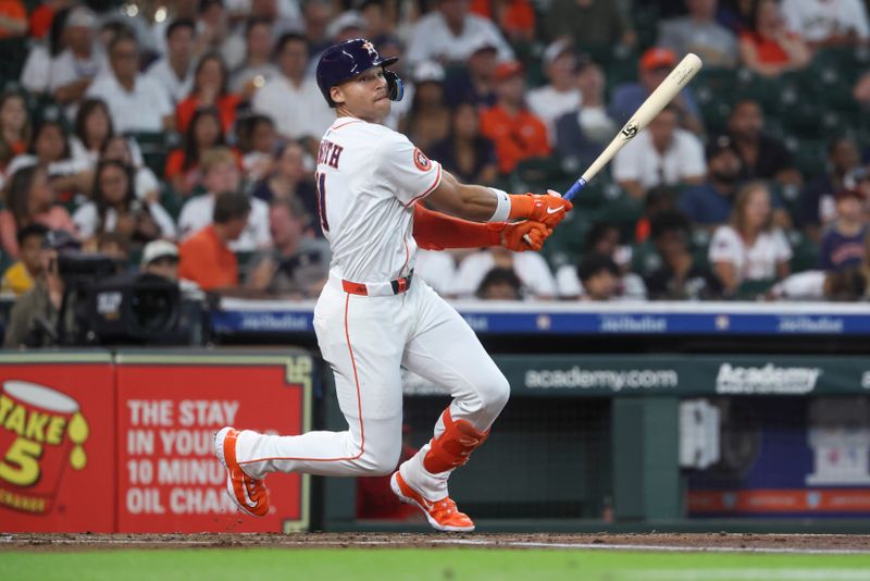Jul 29, 2025; Houston, Texas, USA; Houston Astros right fielder Cam Smith (11) hits an RBI double during the first inning against the Washington Nationals at Daikin Park. Mandatory Credit: Troy Taormina-Imagn Images