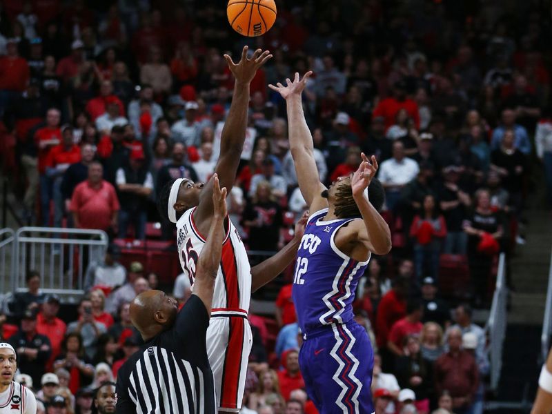 Feb 20, 2024; Lubbock, Texas, USA;  Texas Tech Red Raiders forward Robert Jennings (25) and TCU Horned Frogs forarwd Xavier Cork (12) vie for the opening tip at United Supermarkets Arena. Mandatory Credit: Michael C. Johnson-USA TODAY Sports