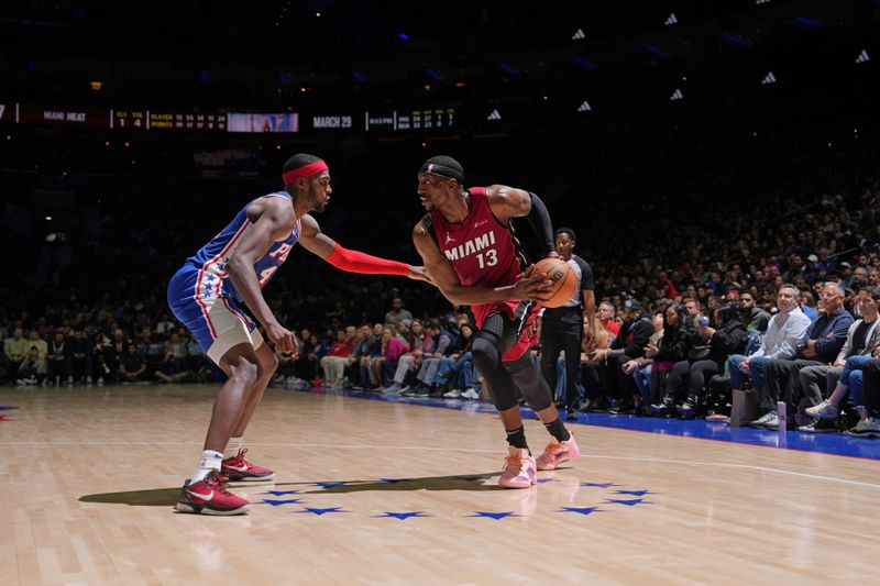 PHILADELPHIA, PA - FEBRUARY 14: Bam Adebayo #13 of the Miami Heat looks to pass the ball during the game against the Philadelphia 76ers on February 14, 2024 at the Wells Fargo Center in Philadelphia, Pennsylvania NOTE TO USER: User expressly acknowledges and agrees that, by downloading and/or using this Photograph, user is consenting to the terms and conditions of the Getty Images License Agreement. Mandatory Copyright Notice: Copyright 2024 NBAE (Photo by Jesse D. Garrabrant/NBAE via Getty Images)