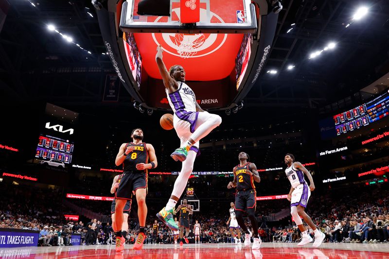 ATLANTA, GEORGIA - NOVEMBER 1: Keon Ellis #23 of the Sacramento Kings dunks during the fourth quarter against the Atlanta Hawks at State Farm Arena on November 1, 2024 in Atlanta, Georgia. NOTE TO USER: User expressly acknowledges and agrees that, by downloading and or using this photograph, User is consenting to the terms and conditions of the Getty Images License Agreement. (Photo by Todd Kirkland/Getty Images)