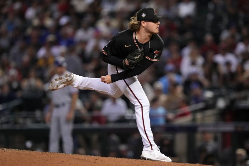 Oct 31, 2023; Phoenix, Arizona, USA; Arizona Diamondbacks relief pitcher Andrew Saalfrank (57) throws a pitch against the Texas Rangers during the ninth inning in game four of the 2023 World Series at Chase Field. Mandatory Credit: Joe Camporeale-USA TODAY Sports