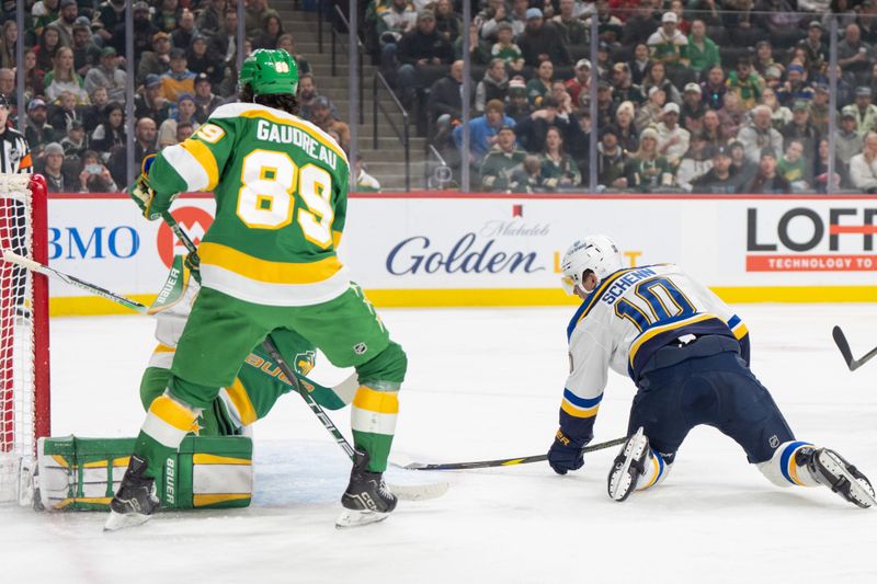 Mar 15, 2025; Saint Paul, Minnesota, USA; St. Louis Blues center Brayden Schenn (10) shoots on the backhand and scores against the Minnesota Wild in the first period at Xcel Energy Center. Mandatory Credit: Matt Blewett-Imagn Images