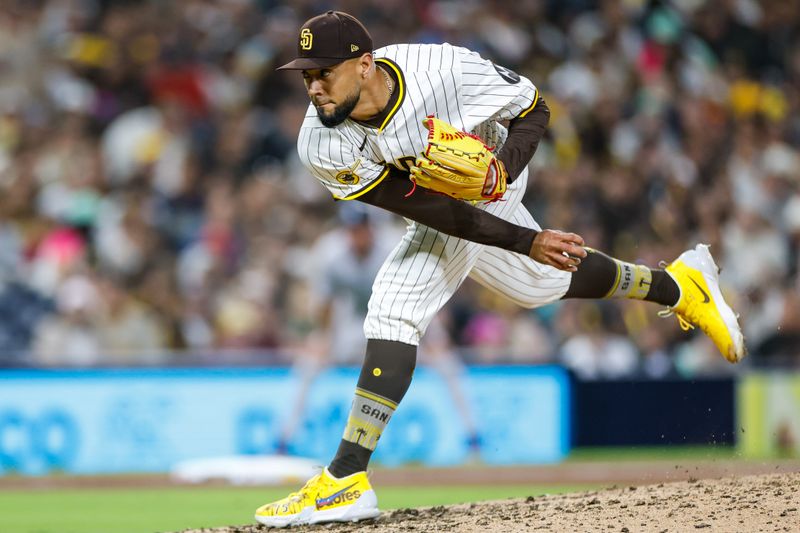 Apr 12, 2025; San Diego, California, USA; San Diego Padres relief pitcher Robert Suarez (75) throws a pitch during the ninth inning against the Colorado Rockies at Petco Park. Mandatory Credit: David Frerker-Imagn Images