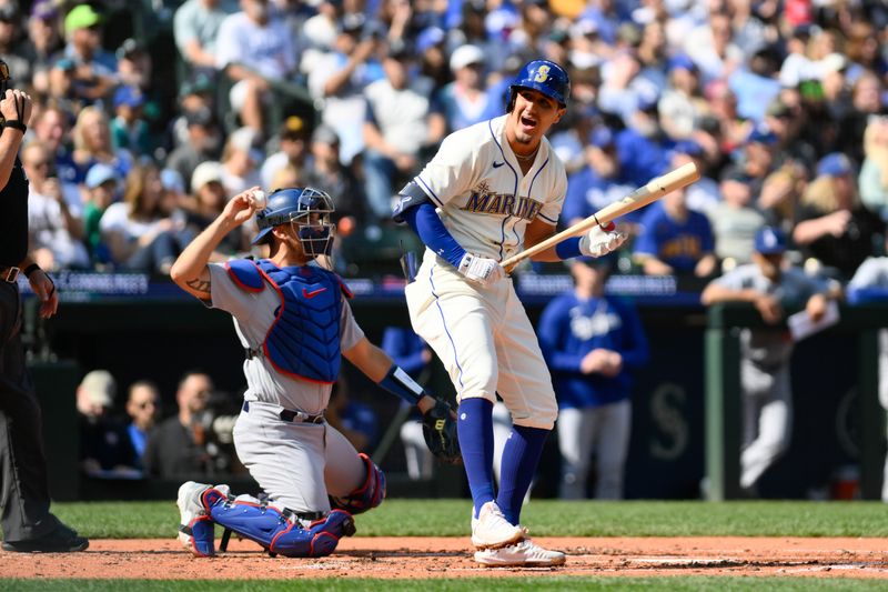 Sep 17, 2023; Seattle, Washington, USA; Seattle Mariners second baseman Josh Rojas (4) reacts to striking out against the Los Angeles Dodgers during the second inning at T-Mobile Park. Mandatory Credit: Steven Bisig-USA TODAY Sports