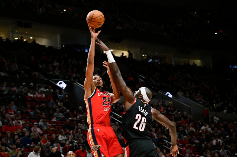 PORTLAND, OREGON - APRIL 09: Trey Murphy III #25 of the New Orleans Pelicans shoots over Duop Reath #26 of the Portland Trail Blazers during the second quarter of the game at the Moda Center on April 09, 2024 in Portland, Oregon. The New Orleans Pelicans won 110-100. NOTE TO USER: User expressly acknowledges and agrees that, by downloading and or using this photograph, User is consenting to the terms and conditions of the Getty Images License Agreement. (Photo by Alika Jenner/Getty Images)