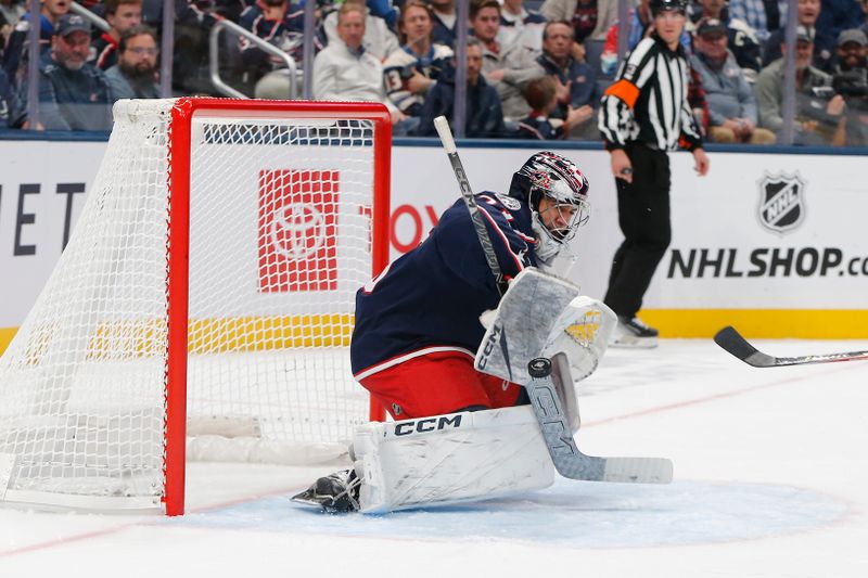 Oct 13, 2025; Columbus, Ohio, USA; Columbus Blue Jackets goalie Jet Greaves (73) makes a stick save against the New Jersey Devils during the second period at Nationwide Arena. Mandatory Credit: Russell LaBounty-Imagn Images