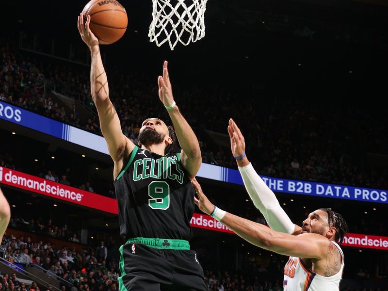 BOSTON, MA - FEBRUARY 3: Derrick White #9 of the Boston Celtics drives to the basket during the game against the Phoenix Suns on February 3, 2023 at TD Garden in Boston, Massachusetts.  NOTE TO USER: User expressly acknowledges and agrees that, by downloading and or using this photograph, User is consenting to the terms and conditions of the Getty Images License Agreement. Mandatory Copyright Notice: Copyright 2022 NBAE  (Photo by Nathaniel S. Butler/NBAE via Getty Images)