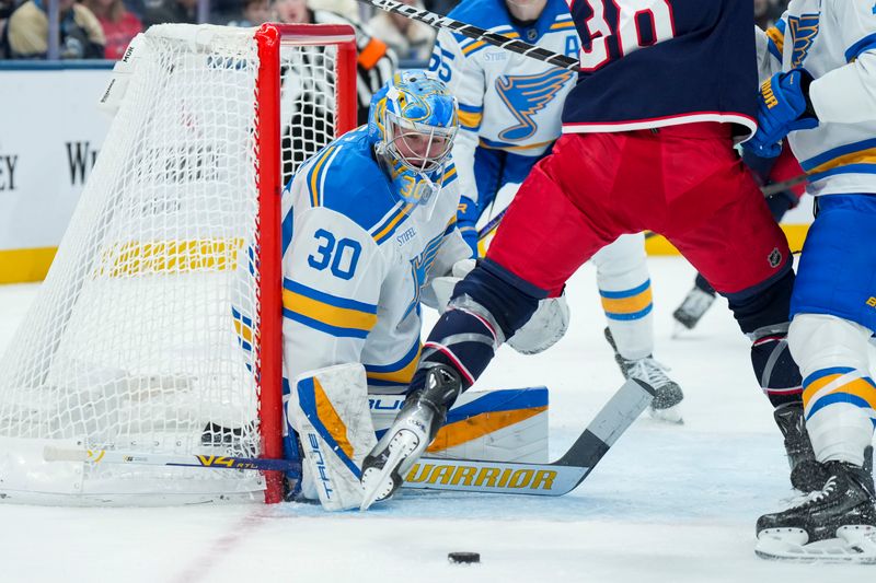 Nov 1, 2025; Columbus, Ohio, USA;  St. Louis Blues goaltender Joel Hofer (30) defends the net against the Columbus Blue Jackets in the second period at Nationwide Arena. Mandatory Credit: Aaron Doster-Imagn Images