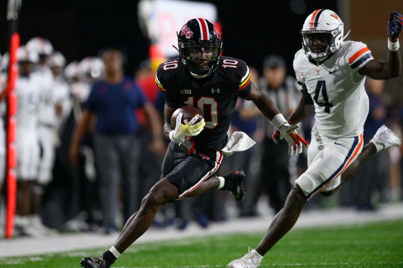 Sep 15, 2023; College Park, Maryland, USA; Maryland Terrapins wide receiver Tai Felton (10) runs the ball against Virginia Cavaliers cornerback Dave Herard (4) during the fourth quarter at SECU Stadium. Mandatory Credit: Reggie Hildred-USA TODAY Sports