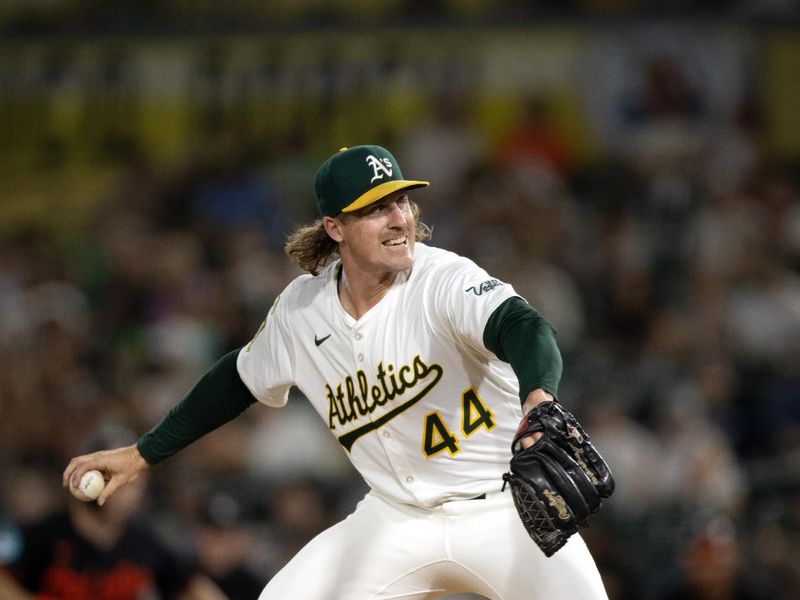 Jun 6, 2025; West Sacramento, California, USA; Athletics pitcher Tyler Ferguson (44) delivers a pitch against the Baltimore Orioles during the eighth inning at Sutter Health Park. Mandatory Credit: D. Ross Cameron-Imagn Images