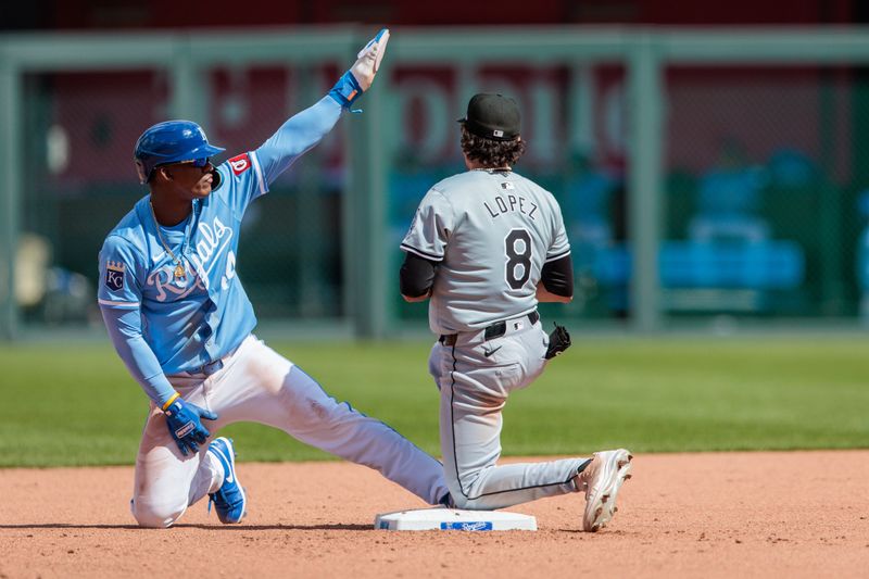 Apr 7, 2024; Kansas City, Missouri, USA; Kansas City Royals pinch runner Austin Nola (14) motions to the bench after stealing 2nd base during the eighth inning against the Chicago White Sox at Kauffman Stadium. Mandatory Credit: William Purnell-USA TODAY Sports