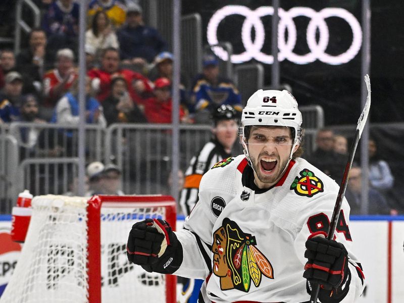 Apr 10, 2024; St. Louis, Missouri, USA;  Chicago Blackhawks left wing Landon Slaggert (84) reacts after scoring his first career NHL goal during the third period against the St. Louis Blues at Enterprise Center. Mandatory Credit: Jeff Curry-USA TODAY Sports