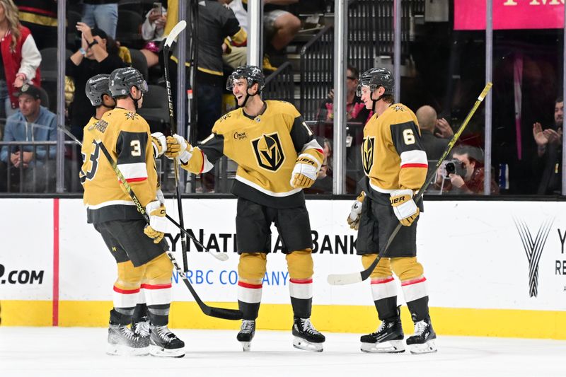 Oct 28, 2024; Las Vegas, Nevada, USA; Vegas Golden Knights center Nicolas Roy (10) celebrates his third-period goal with teammates against the Calgary Flames at T-Mobile Arena. Mandatory Credit: Candice Ward-Imagn Images