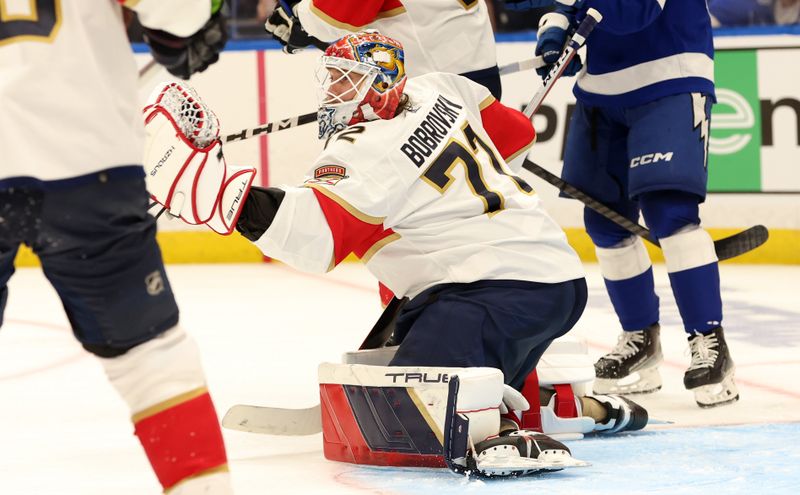 Apr 25, 2024; Tampa, Florida, USA; Florida Panthers goaltender Sergei Bobrovsky (72) makes a save against the Tampa Bay Lightning during the third period in game three of the first round of the 2024 Stanley Cup Playoffs at Amalie Arena. Mandatory Credit: Kim Klement Neitzel-USA TODAY Sports