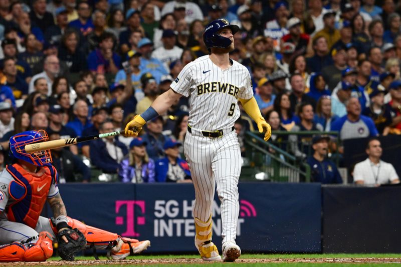 Oct 3, 2024; Milwaukee, Wisconsin, USA; Milwaukee Brewers pinch hitter Jake Bauers (9) hits a solo home run against the New York Mets in the seventh inning during game three of the Wildcard round for the 2024 MLB Playoffs at American Family Field. Mandatory Credit: Benny Sieu-Imagn Images