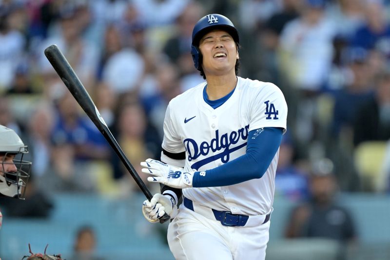 May 18, 2024; Los Angeles, California, USA;  Los Angeles Dodgers designated hitter Shohei Ohtani (17) reacts after a foul ball in the third inning against the Cincinnati Reds at Dodger Stadium. Mandatory Credit: Jayne Kamin-Oncea-USA TODAY Sports