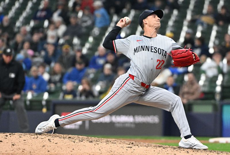 Apr 3, 2024; Milwaukee, Wisconsin, USA; Minnesota Twins relief pitcher Griffin Jax (22) delivers a pitch against the Milwaukee Brewers in the eighth inning at American Family Field. Mandatory Credit: Michael McLoone-USA TODAY Sports