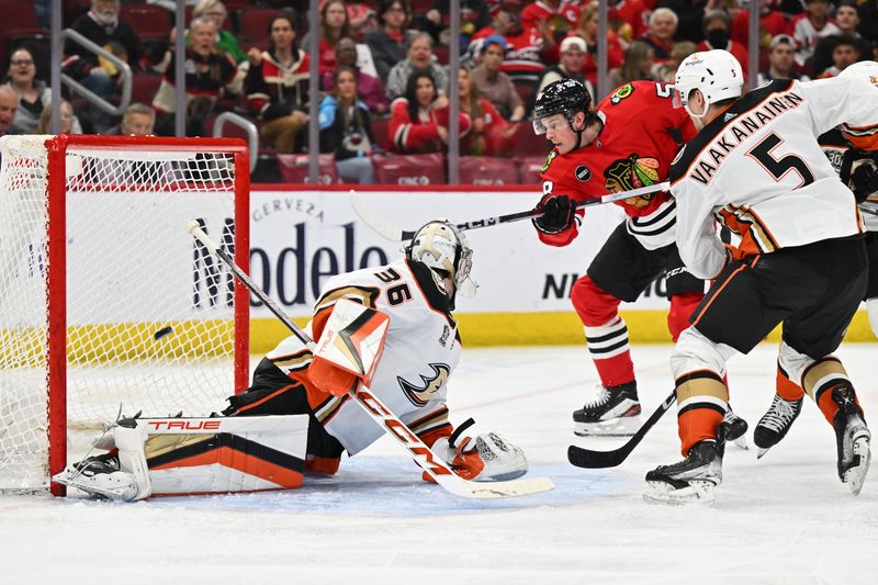 Mar 12, 2024; Chicago, Illinois, USA; Chicago Blackhawks forward MacKenzie Entwistle (58) scores a goal on Anaheim Ducks goaltender John Gibson (36) in the third period at United Center. Mandatory Credit: Jamie Sabau-USA TODAY Sports