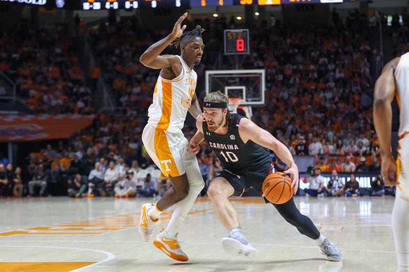 Feb 25, 2023; Knoxville, Tennessee, USA; South Carolina Gamecocks forward Hayden Brown (10) moves the ball against Tennessee Volunteers guard Jahmai Mashack (15) during the first half at Thompson-Boling Arena. Mandatory Credit: Randy Sartin-USA TODAY Sports