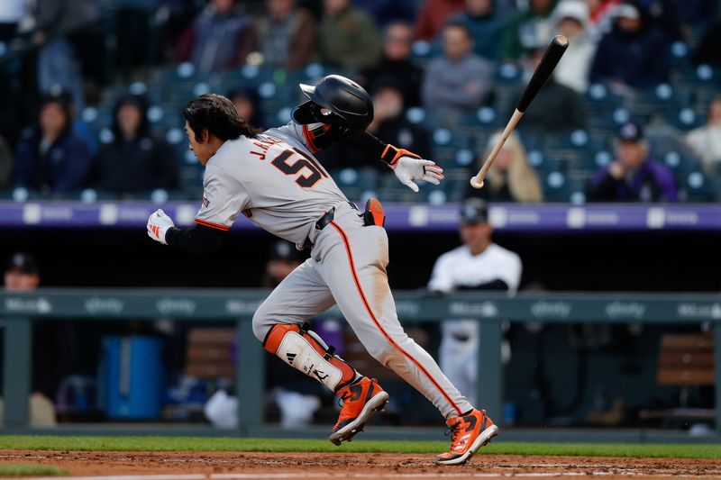 May 7, 2024; Denver, Colorado, USA; San Francisco Giants center fielder Jung Hoo Lee (51) hits a single in the fourth inning against the Colorado Rockies at Coors Field. Mandatory Credit: Isaiah J. Downing-USA TODAY Sports