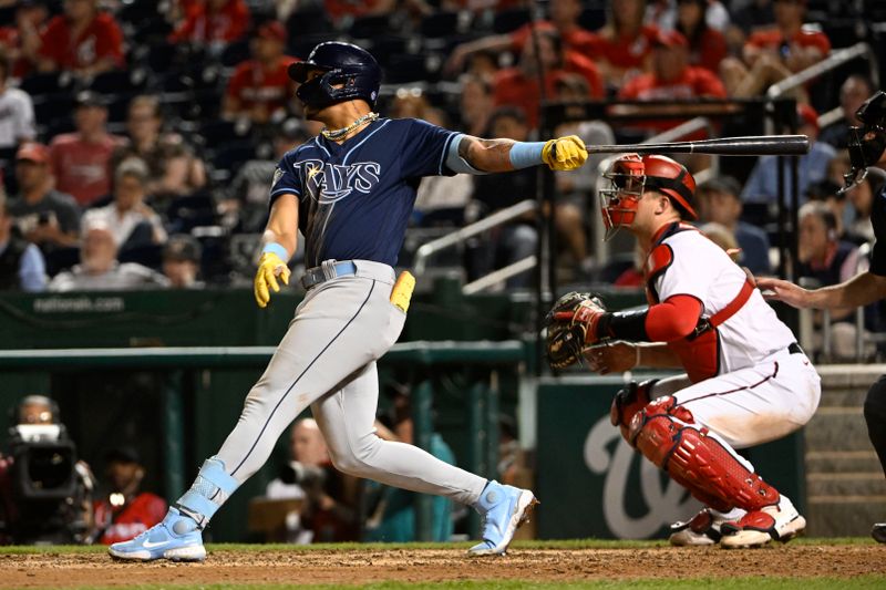 Apr 4, 2023; Washington, District of Columbia, USA; Tampa Bay Rays center fielder Jose Siri (22) doubles  against the Washington Nationals during the ninth inning at Nationals Park. Mandatory Credit: Brad Mills-USA TODAY Sports