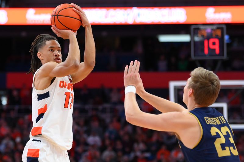 Jan 14, 2023; Syracuse, New York, USA; Syracuse Orange forward Benny Williams (13) shoots the ball against the defense of Notre Dame Fighting Irish guard Dane Goodwin (23) during the first half at the JMA Wireless Dome. Mandatory Credit: Rich Barnes-USA TODAY Sports