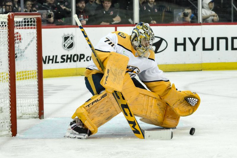 Apr 7, 2024; Newark, New Jersey, USA; Nashville Predators goaltender Juuse Saros (74) makes a save against the New Jersey Devils during the second period at Prudential Center. Mandatory Credit: John Jones-USA TODAY Sports