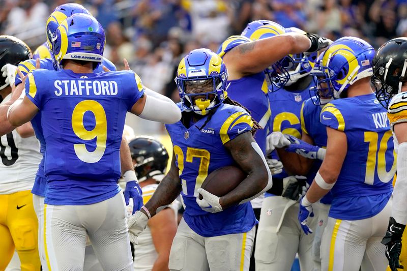 Los Angeles Rams running back Darrell Henderson, center, reacts after scoring a touchdown during the second half of an NFL football game against the Pittsburgh Steelers Sunday, Oct. 22, 2023, in Inglewood, Calif. (AP Photo/Ashley Landis)