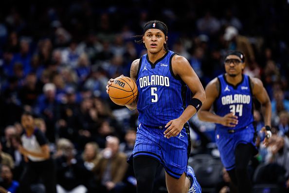 ORLANDO, FLORIDA - DECEMBER 20: Paolo Banchero #5 of the Orlando Magic dribbles the ball during the second half of a game against the Miami Heat at the Kia Center on December 20, 2023 in Orlando, Florida. NOTE TO USER: User expressly acknowledges and agrees that, by downloading and or using this photograph, User is consenting to the terms and conditions of the Getty Images License Agreement. (Photo by James Gilbert/Getty Images)