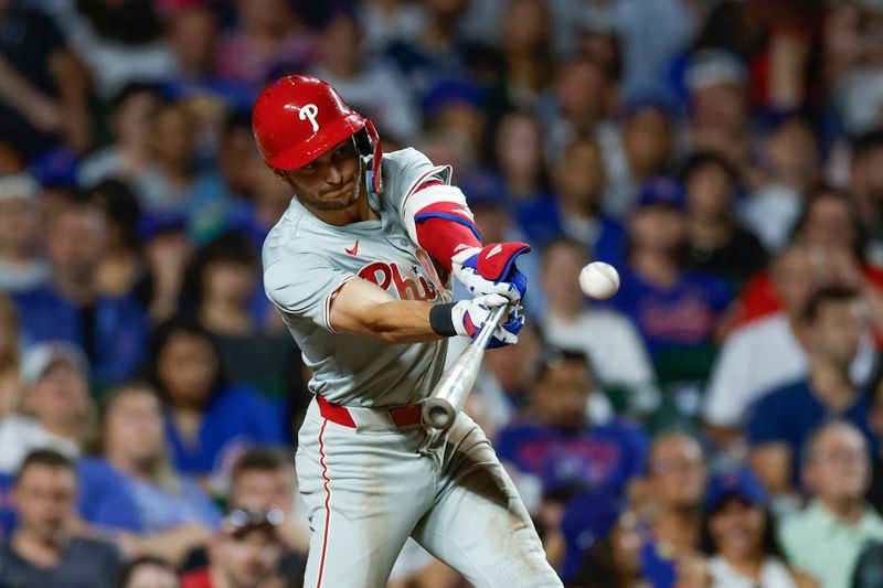 Jul 3, 2024; Chicago, Illinois, USA; Philadelphia Phillies shortstop Trea Turner (7) singles against the Chicago Cubs during the eight inning at Wrigley Field. Mandatory Credit: Kamil Krzaczynski-USA TODAY Sports