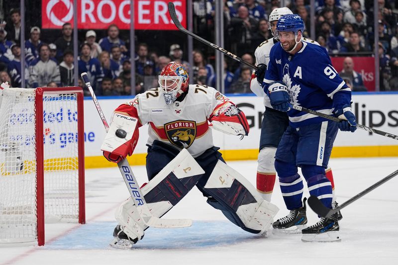 May 5, 2025; Toronto, Ontario, CAN; Florida Panthers goaltender Sergei Bobrovsky (72) and Toronto Maple Leafs forward John Tavares (91) watch a shot go wide of the net during the third period of the second round of the 2025 Stanley Cup Playoffs at Scotiabank Arena. Mandatory Credit: John E. Sokolowski-Imagn Images