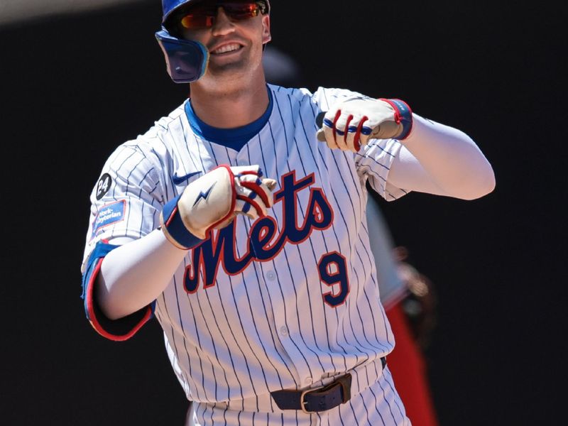 Jul 11, 2024; New York City, New York, USA; New York Mets left fielder Brandon Nimmo (9) reacts after hitting a three RBI double during the fifth inning against the Washington Nationals at Citi Field. Mandatory Credit: Vincent Carchietta-USA TODAY Sports