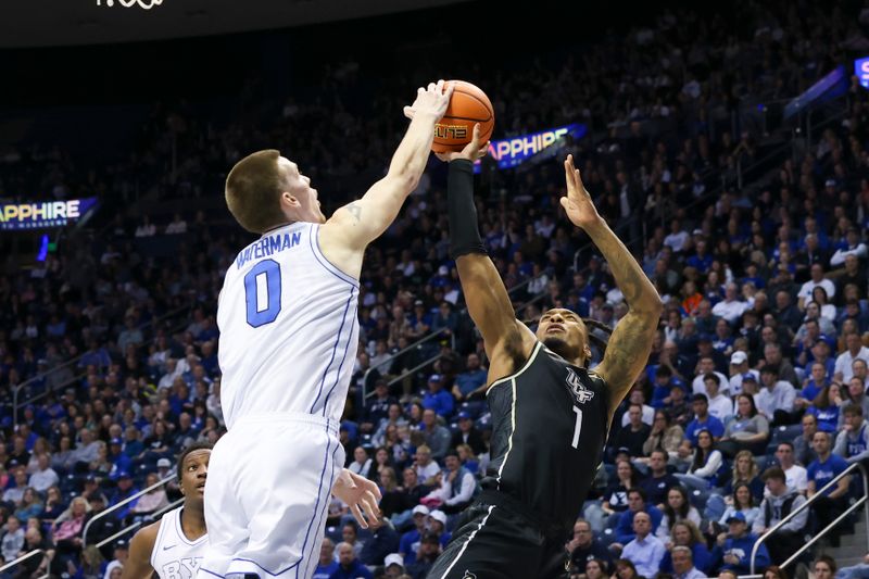 Feb 13, 2024; Provo, Utah, USA; Brigham Young Cougars forward Noah Waterman (0) blocks the shot of Central Florida Knights guard Antwann Jones (1) during the first half at Marriott Center. Mandatory Credit: Rob Gray-USA TODAY Sports