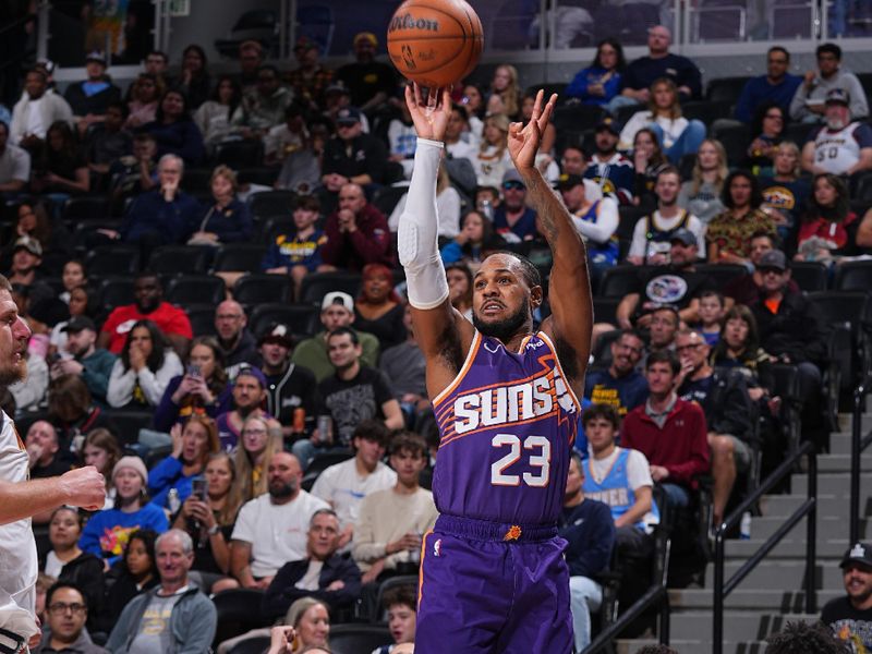 DENVER, CO - OCTOBER 13: Monte Morris #23 of the Phoenix Suns shoots a three point basket during the game against the Denver Nuggets on October 13, 2024 at Ball Arena in Denver, Colorado. NOTE TO USER: User expressly acknowledges and agrees that, by downloading and/or using this Photograph, user is consenting to the terms and conditions of the Getty Images License Agreement. Mandatory Copyright Notice: Copyright 2024 NBAE (Photo by Bart Young/NBAE via Getty Images)