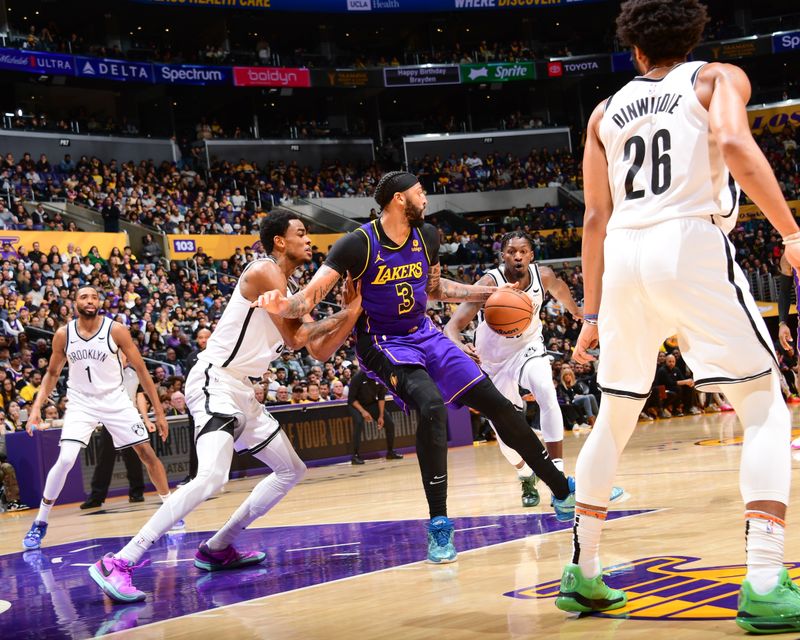 LOS ANGELES, CA - JANUARY 19:  Anthony Davis #3 of the Los Angeles Lakers handles the ball during the game  on January 19, 2024 at Crypto.Com Arena in Los Angeles, California. NOTE TO USER: User expressly acknowledges and agrees that, by downloading and/or using this Photograph, user is consenting to the terms and conditions of the Getty Images License Agreement. Mandatory Copyright Notice: Copyright 2024 NBAE (Photo by Adam Pantozzi/NBAE via Getty Images)