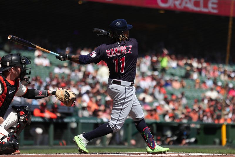 Sep 13, 2023; San Francisco, California, USA; Cleveland Guardians third baseman Jose Ramirez (11) hits a two run home run during the first inning against the San Francisco Giants at Oracle Park. Mandatory Credit: Sergio Estrada-USA TODAY Sports