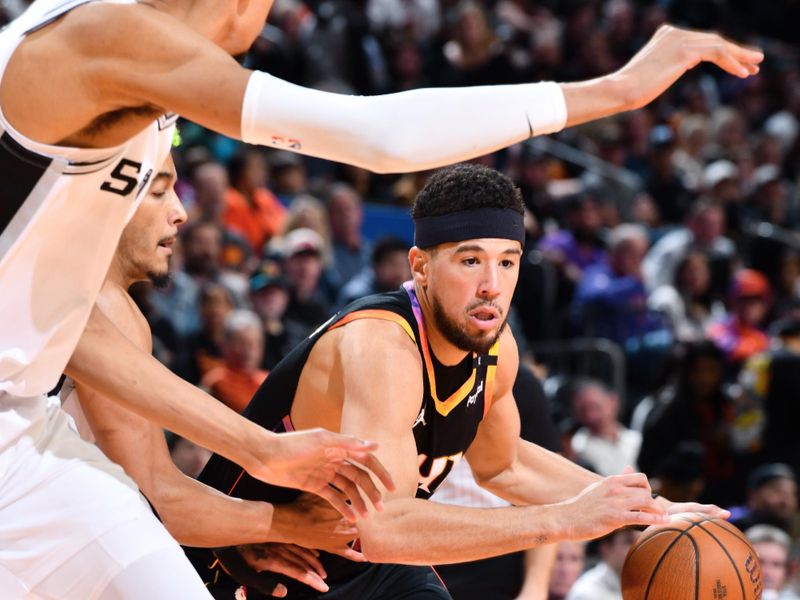 PHOENIX, AZ - DECEMBER 3: Devin Booker #1 of the Phoenix Suns drives to the basket during the game against the San Antonio Spurs during a Emirates NBA Cup game on December 3, 2024 at Footprint Center in Phoenix, Arizona. NOTE TO USER: User expressly acknowledges and agrees that, by downloading and or using this photograph, user is consenting to the terms and conditions of the Getty Images License Agreement. Mandatory Copyright Notice: Copyright 2024 NBAE (Photo by Barry Gossage/NBAE via Getty Images)