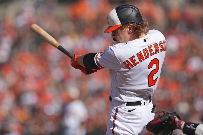 Oct 1, 2023; Baltimore, Maryland, USA; Baltimore Orioles shortstop Gunnar Henderson (2) makes contact in the first inning against the Boston Red Sox at Oriole Park at Camden Yards. Mandatory Credit: Mitch Stringer-USA TODAY Sports