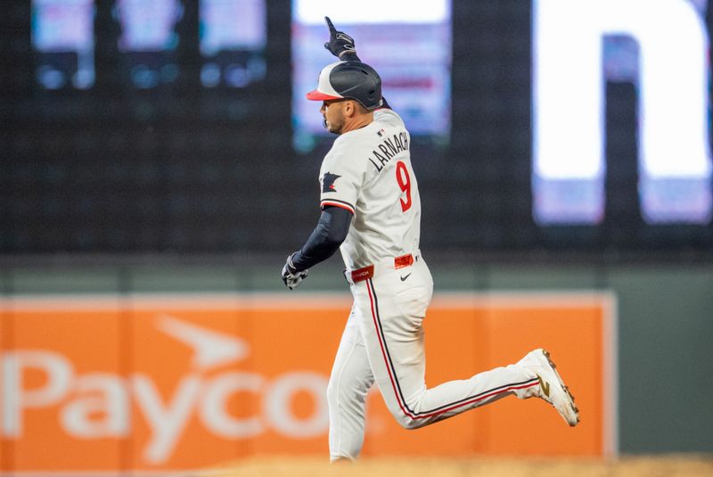 Apr 23, 2025; Minneapolis, Minnesota, USA; Minnesota Twins right fielder Trevor Larnach (9) hits a home run off Chicago White Sox pitcher Jordan Leasure (49) in the sixth inning at Target Field. Mandatory Credit: Matt Blewett-Imagn Images